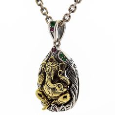 Sterling Silver Hindu Amulet Brass Ganesh Pendant New  made of durable 925 sterling silver and brass;   complemented with green, red, and pink CZ gems;   925 stamp is placed on the bail;  Pendant’s weight: 12 grams;   Dimensions: 22 mm x 40 mm (0.85” x 1.55”);  Hand-made pendant;  A necklace is not included.   They say that wise, kind, and good-natured Ganesha is able to remove any obstacle from your path thus helping you reach your goals faster and easier. If you believe in the power of this mi Silver Gemstone Jewelry For Good Luck, Traditional Sterling Silver Jewelry For Good Luck, Traditional Jewelry For Good Luck And Festivals, Ganesh Pendant, Ganesha Pendant, Skull Wedding, Dog Ring, Dragon Bracelet, Mens Bracelet Silver