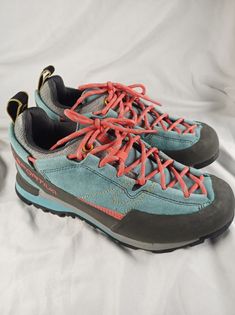 La Sportiva Women's Hiking Shoes Size 9. They seem to run small. I wear a 8 and they were a little  tight on me. Box has a tear and shelf wear but shoes are brand new. Please see photos. Blue Lace-up Walking Shoes For Outdoor Activities, La Sportiva Shoes, Blue Sneakers With Vibram Sole For Hiking, Outdoor Sneakers With Vibram Sole, Sneakers With Vibram Sole For Outdoor Activities, Closed Toe Sneakers With Vibram Sole For Outdoor Activities, Blue Walking Shoes With Vibram Sole And Round Toe, Blue Walking Shoes With Vibram Sole, Blue Walking Shoes With Rubber Sole For Hiking