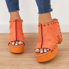 Elevate your style with these Orange Open Toe Heeled Clogs. Featuring a vintage-inspired design, studded detailing, and a platform heel, these mules are perfect for adding flair to any outfit. Color: Orange Heel Type: Chunky heel Heel Height: 4.72" / 120 mm approx Product measurements were taken using size 8. Please note that measurements may vary by size. Toe: Open toe With platform Vintage platform clogs design Studs embellishment Handcrafted US sizing. Fits true to size. Casual Clogs With Chunky Platform And Open Heel, Casual Open Heel Clogs With Chunky Platform, Casual Orange Platform Heels, Spring High Heel Clogs With Studded Rubber Outsoles, Orange Closed Toe Clogs For Summer, Summer Orange Closed Toe Clogs, Spring Orange Clogs With Round Toe, Orange Round Toe Clogs For Summer, Summer Orange Round Toe Clogs