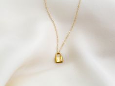 "Dainty lock necklace! The pendant is made of gold vermeil, which is heavy gold plating over sterling silver. Pair it with your favorite outfit! Layer with other necklaces, by or wear itself for a pop! . . . . . . . . . . . . . . . . . . . . . . . . . . . . . . . . . . . . . . . . . . NECKLACE + Length: 16\" + 2\" extender + Vermeil (18k gold plating over sterling silver) -or- sterling silver lock pendant: 8mm x 11mm + 14k gold filled -or- sterling silver chain, spring clasp, & findings LAYE Yellow Gold Chain Necklace With Gold Clasp As Gift, Gold Chain Necklace With Lock For Gift, Gold Lock Necklace As Gift, Everyday Gold Lock Jewelry, Everyday Gold Jewelry With Lock Detail, Yellow Gold Necklace With Lock As Gift, Lock Charm Necklace, Necklace Lock, Padlock Necklace