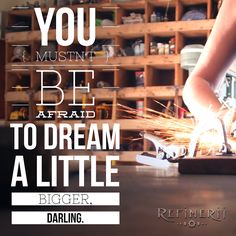 a woman is working on some kind of thing with sparks in her hand and the words, you mustt be afraid to dream little bigger