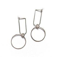 Very lightweight and easy to wear everyday hoop earrings with a circle drop. Made with 20 gauge wire - about .8mm thick. A perfect addition to a minimalist capsule wardrobe. Dainty enough to wear on a daily basis but dressy enough for a special occasion.These minimalist hoops are available in 14k gold fill or sterling silver - about 2" long. Size may vary slightly due to the handmade nature of these earrings. See photos provided on ear for scale. Please note these earrings are handmade to order Modern Nickel-free Open Circle Hoop Earrings, Minimalist Metal Hoop Earrings For Everyday, Minimalist Open Circle Metal Earrings, Minimalist Metal Open Circle Earrings, Minimalist Small Hoop Metal Earrings, Minimalist Small Hoop Earrings In Metal, Minimalist Small Hoop Clip-on Earrings, Minimalist Small Metal Hoop Earrings, Metal Open Circle Earrings