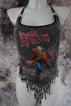 For sales, new products and custom order go directly to my website tormentor237.bigcartel.com Iron Maiden halter top Customized from an official T-Shirt Ripped at the bottom Silver rivets all over the front O-ring on the straps Strap to tie behind the neck Size S Flat measurements Bust: 16.5" (42cm) Waist: 15" (38cm) Please note: All sales are final. Check the measurements carefully and make sure you agree to the terms and conditions before each order. Packages are all sent with a tracking numbe Fitted Alternative Top For Concert, Fitted Alternative Top For Concerts, Fitted Alternative Style Top For Concerts, Fitted Punk Tops For Music Festival, Punk Style Fitted Top For Music Festival, Distressed Rocker Tops For Alternative Fashion, Rocker Fitted Tops For Halloween, Alternative Tops With Band Logo For Music Festivals, Alternative Band Logo Tops For Music Festivals