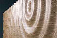 a large white sculpture sitting on top of a wooden floor