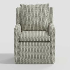 an upholstered chair with grey and white patterned fabric