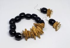 Black and Beige Beach Wood Earring and Bracelet Set. Back with another one of our popular wooden jewelry sets! Earring and bracelet set incorporating reclaimed wooden bead elements. This is a great summer piece. Pack this one in your bags for your beach getaway! Light in on the body, but heavy in style. Stretch Bracelet. One Size. Beige Beach, Wood Earring, Beach Wood, Beach Getaway, Black And Beige, Beach Getaways, Wood Earrings, Wooden Jewelry, Wooden Beads