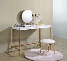 a vanity table with a mirror, stool and cosmetics on it next to a wall