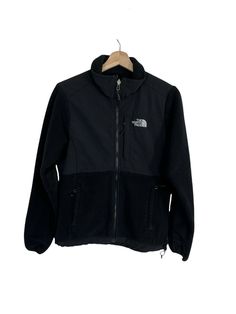 The North Face Denali Jacket Womens Small Black Polartec Full Zip  Great preowned condition. The pockets have holes on the inside and there is light fabric wear on the inside of the jacket but the outside in in great condition.  Approximate Measurements(in inches, laying flat): Please compare measurements with a similar item that fits you well. Shoulder to shoulder: 15.5" Pit to pit: 19.5" Fron length: 24.5" Back length: 25.5" Waist: 17.5" Sleeve: 25.5" Please remember all clothing items may fit Functional Black Fleece Jacket With Pockets, Black Fleece Jacket With Pockets For Outdoor, Black Outdoor Fleece Jacket With Pockets, The North Face Black Long Sleeve Fleece Jacket, The North Face Black Hooded Fleece Jacket, The North Face Black Techwear Outerwear, Black The North Face Techwear Outerwear, The North Face Black Fleece Jacket For Outdoor, The North Face Black Fleece Jacket For Outdoor Activities