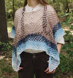 A crochet poncho is the colors of a beach and ocean wave, Made with 100% acrylic yarn in a mesh stitch, it's a perfect accessory for a summer cover-up, or a sea witch fantasy costume for Ren Faire! It's 11 inches from the neckline at the shortest point, and 22 inches from the neck at the longest point. Care Instructions: Machine wash and dry warm, do not iron or bleach. Pattern by: Crazy Cool Crochet Sheepberry's Sustainability Practices -Used or discounted yarn (when possible) -Making use of all fiber scraps -Recycled and reused packaging Beach Poncho With Open Knit One Size, Beach Open Knit Poncho One Size, Beach Poncho In Open Knit One Size, Summer Beach Open Knit Poncho, Open Knit Summer Beach Poncho, Bohemian Open Knit Beach Poncho, Bohemian Open Knit Poncho For Beach, One Size Open Knit Poncho For Summer, Bohemian Open Knit Poncho For Summer