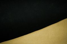 a close up view of a black and yellow background