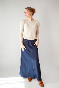 With the look of real denim but the feel of soft knit, comfort is the key element in our Caroline skirt. The quick, effortless pull-on style makes this skirt an effortless option for every day. Larger waist-size? The elastic waistband gives stretch without feeling bulky. A skirt like this will take you through the day, from grocery shopping to making dinner, or even a quick coffee shop visit for a chat with a friend over lattes! This skirt has become a best-seller. Style: elastic waist, soft knit fabric, functioning back pockets Color: navy denim Fabric content: 65% Cotton, 30% Polyester, 5% Spandex Care instructions: wash gentle cycle, cold; lay flat to dry, cool iron if needed. Our sizing is always approximate and can also vary due to personal preference and body shape. Please allow a 1" Casual Stretch Dark Wash Skirt, Fall Stretch Medium Wash Skirt, Fall Denim Stretch Skirt, Denim Skirt With Elastic Waistband, Relaxed Fit, Relaxed Denim Skirt With Elastic Waistband, Everyday Fall Lined Skirt, Relaxed Fit Denim Skirt With Elastic Waistband, Casual Long Stretch Denim Skirt, Casual Stretch Long Denim Skirt