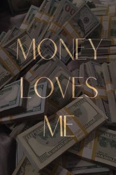 the words money loves me surrounded by stacks of cash