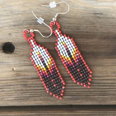 "Native Beaded Feather Earrings Beadwork Design: Beaded Eagles Feather Measurements: Beadwork approx. 2\" long x 1/2\" wide PLUS 5/8\" ear wires We hope you will check out the rest of our beadwork, fingerweaving and artwork! Our shop's home page is www.etsy.com/shop/offtherezarts SHIPPING/ORDERING INFO: * Please review item descriptions carefully before making a purchase as we do not accept returns/exchanges/refunds/cancellations. Don't hesitate to contact us with any and all questions you may h Beaded Feather Earrings, Beaded Feather, Native American Beadwork Patterns, Beaded Moccasins, Horse Earrings, Diamond Shape Earrings, Beadwork Designs, Beaded Earrings Tutorials, Camping Shower