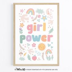 a poster with the words girl power on it in front of a white wall and wooden frame