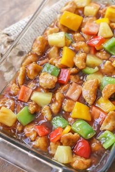 a glass casserole dish filled with meat and vegetables