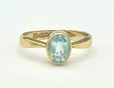 For your consideration is this   solitaire oval facet cut Aquamarine stone set in a 18kt gold white gold setting  the size of the ring is 6 1/2 stone.   is 6mm x 8mm inside is marked 18  it has English Markings  with makers mark W N  weight is 2.46 grams the main stone is facet cut rectangle shape  12 mm x 10mm height of 3mm  the ring is in good condition, Modern Oval Topaz Ring For Formal Occasions, Oval Topaz Ring For Formal Occasions, Oval Heirloom Topaz Ring For Formal Occasions, Formal Oval Topaz Ring With Polished Finish, Hallmarked Oval Topaz Ring For Anniversary, Blue Oval Topaz Ring With Bezel Setting, Oval Yellow Gold Topaz Ring With Bezel Setting, Formal Oval Hallmarked Topaz Ring, Formal Oval Topaz Ring Hallmarked