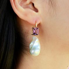 14K Solid Gold 2 Pieces 8 x 10 mm Amethyst｜Purple｜Emerald-Cut｜Eye Clean Amethyst CTW: 6.20 Diamond Grade: G Color｜VS Clarity Diamond CTW: 0.05 Detachable Cultured Baroque Pearls Approx. 15 x 25 mm Measurements: 1 3/4 " length｜3/4 " width Convertible Features: You can wear the natural gemstones alone or with detachable pearls for a more stunning look. Our unique design allows you to MIX and MATCH with other gemstones or pearls from our convertible collections, perfect for any occasion or style! Elegant Purple Briolette Earrings, Elegant Purple Gemstone Pearl Earrings, Elegant High Luster Purple Jewelry, Elegant Purple High Luster Jewelry, Elegant Pink Amethyst Earrings, Elegant Amethyst Earrings With Pearl Drop, Elegant Amethyst Pearl Drop Earrings, Elegant Amethyst Earrings As A Gift, Purple Pear-shaped Elegant Jewelry