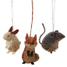 three ornaments are hanging from strings in the shape of hedgehogs and an antelope