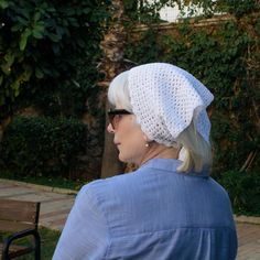 This boho crochet lace bandana is a delicate and lightweight accessory, crafted from 100% fine mercerized cotton, giving it a subtle sheen and extra softness. The elegant, airy design is perfect for vacations, casual outings, or as a unique addition to your everyday boho style. The pure white color adds a versatile touch, and the hand-crocheted lace makes this piece truly special. Measurements: Length: 26 inches (67 cm) without ties Ties: 2.5 inches (7 cm) each Height: 12 inches (30 cm) This lightweight and soft bandana is ideal for warm weather. Its delicate nature requires gentle handling. Pair it with the crochet bags available in our shop for a complete boho-chic look! Crochet Lace Bandana, White Hair Scarf, Lace Bandana, Vacation Accessories, Crocheted Lace, Hair Scarf, Lace Making, Boho Crochet, Turbans