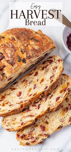 a loaf of bread sitting on top of a counter next to some cranberry sauce