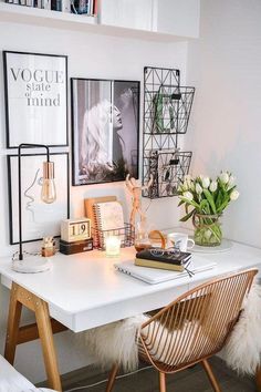 a white desk with some pictures on the wall