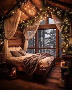 a bedroom decorated for christmas with lights on the ceiling and curtains hanging over the bed