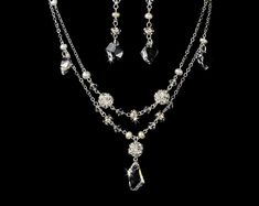 "Stylish and elegant, this silver or gold plated necklace and earring set is the perfect accessory for your wedding, honeymoon or special occasion. The set features freshwater pearls and clear Swarovski crystals, the perfect finishing touch to your vintage chic or classic wedding dress. READY TO SHIP DETAILS: - Necklace: 15\" long with a 2.5\" adjustable extender, Earrings: 1.5\" long. - Earrings - 2\" (Length) - Offered in Gold or Silver COORDINATING SASHES, CUFF BRACELETS & FASCINATORS, VI Silver Jewelry Sets With Pearl Drop For Formal Occasions, Anniversary Crystal Jewelry With Pearl Drop, Silver Costume Jewelry Sets For Weddings, White Gold Jeweled Wedding Jewelry, Silver Costume Jewelry For Wedding, Elegant Silver Dangle Jewelry Sets, Gold Sterling Silver Jewelry Sets For Wedding, Classic Silver Necklace For Mother Of The Bride, Wedding Sterling Silver Necklace With Matching Earrings