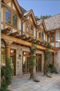 a large house with stone and wood accents