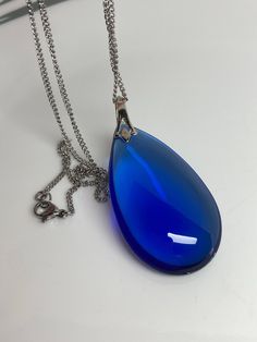 Blue Teardrop Drop Necklace For Party, Blue Drop Necklace For Party, Blue Briolette Drop Necklace, Blue Briolette Jewelry For Party, Blue Drop Necklaces For Party, Blue Briolette Drop Necklace Gift, Blue Briolette Drop Necklace For Gift, Blue Long Drop Necklace As A Gift, Blue Long Drop Necklace As Gift