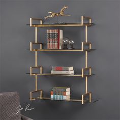 a book shelf with books on it against a gray wall