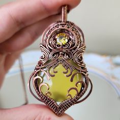 This wire wrapped yellow chalcedony necklace with yellow colored cubic zirconia accent is made with pure copper wire that has been meticulously hand shaped, hammered, filed, sanded, antiqued, and polished to a high shine, and comes on your choice of black cord or chain. This piece was truly a labor of love with over 40 hours of creation time behind it.  Please note that natural materials and crystals display different color properties depending on lighting. I try to take all my photos in a combination of sunlight and shade to reflect different color play. Colors also may vary or show up differently on other monitors and screens. Luxury Wire Wrapped Necklaces, Bohemian Chalcedony Wire Wrapped Jewelry, Bohemian Wire Wrapped Chalcedony Jewelry, Yellow Wire Wrapped Necklace As Gift, Yellow Wire Wrapped Necklace For Gift, Unique Yellow Wire Wrapped Jewelry, Handmade Yellow Citrine Necklaces, Bohemian Citrine Wire Wrapped Jewelry, Bohemian Wire-wrapped Citrine Jewelry