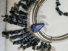 Vintage Peruvian Lapis Silver Bib Style Necklace,, lovely craftsmanship.. each stone is linked with silver wire and a nice Lapis stone inlaid in silver ornate metal is the center pieces.. shorter style necklace.. 15 inches Festival Silver Jewelry With Stones, Silver Gemstone Necklace For Festival, Silver Wire Wrapped Bohemian Necklaces, Silver Wire Wrapped Bohemian Necklace, Bohemian Metal Necklaces With Stones, Bohemian Sterling Silver Stone Necklaces, Bohemian Silver Beaded Gemstone Necklace, Silver Beaded Necklaces With Natural Stones, Silver Bohemian Beaded Necklace With Natural Stones