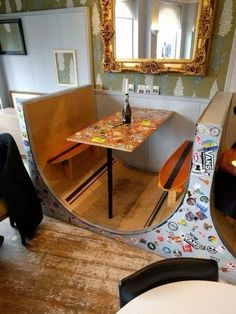 a fisheye lens view of a dining room table and chairs in front of a mirror