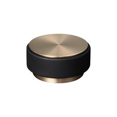 a black and gold knob on a white background