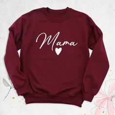 "Mama Heart Sweatshirt, Mommy Hoodie, Mom Sweater, new mama outfit, Mothers Day Shirt, Mom Long Sleeve Shirt, Mom Birthday Gift, Mama T-Shirt Hello, Thanks for your support. Your gladness comes first and all work is done with LOVE in here. Always keep your support please:) Sweatshirts and hoodies are branded Gildan. HOW TO ORDER MAMA FLORAL SWEATSHIRTS, HOODIES, OR LONG SLEEVE -Please, check and review all photos. -Select Your sweatshirt, hoodie or long sleeve's size and color from drop down menus. -Choose your quantity as much as you want. -Click ADD TO CART your sweatshirt, hoodie or long sleeve. You can go back to add more product color for your family members anytime you want or you can complete the checkout process. -Please click the \"Proceed to Check Out\" button MAMA FLORAL SWEATSH Family Matching Sweatshirt With Name Print For Mother's Day, Casual Mother's Day Sweatshirt For Family, Casual Sweatshirt For Mother's Day Family Gathering, Casual Sweatshirt For Mother's Day Family Event, Casual Sweatshirt For Mother's Day, Casual Sweatshirt For Family Mother's Day, Mom Sweater, Heart Hoodie, Mama T Shirt