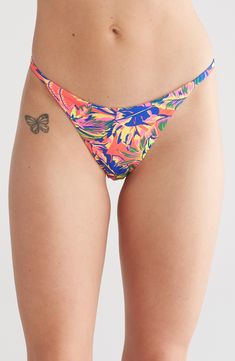 Make a splash in this vibrant reversible print bikini bottoms while you soak up the sun by the poolside. Pattern on reverse side may vary 52% regenerate polyamide, 30% polyamide, 18% spandex Hand wash, dry flat Imported Vibrant Stretch Swimwear For Sunbathing, Vibrant Stretch Swimwear For Pool, Colorful Stretch Swimwear For Pool, Multicolor Stretch Swimwear For Poolside, Vibrant Fitted Poolside Bottoms, Vibrant Fitted Bottoms For Poolside, Bold Swimwear For Sunbathing And Beach Season, Vibrant Summer Swim Bottoms, Multicolor Bottoms For Pool And Beach Season