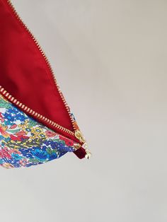 "100% Cotton. Lightweight. From the world famous Liberty Fabrics with a silk-like touch, unique print quality and striking color vibrancy. This pouch is great size for a couple of small items. Size is 7.75\"W / 6.25\"H (20cm / 15.5cm) Fabric is Liberty of London Tana Lawn. The pouch opens with golden color zipper.(High quality YKK zipper) It comes with a velvet ribbon on one side. Lined inside with red color cotton. Please, Hand wash. Or cool brilliantly on a machine hand wash. All my works are Multicolor Pouch Cosmetic Bag As Gift, Multicolor Zipper Pouch Clutch As Gift, Red Cosmetic Bag With Zipper Closure - Gift, Multicolor Cosmetic Bag With Zipper Closure As Gift, Red Cosmetic Bag With Zipper, Red Zipper Cosmetic Bag, Multicolor Zipper Pouch As A Gift, Red Pencil Case Pouch Gift, Pouch Clutch With Zipper Closure Gift