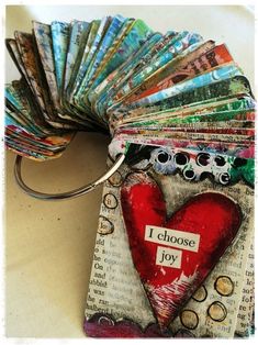 a close up of a keychain with many different types of cards on it