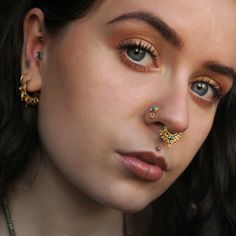 Beautiful 2-micron gold plating over sterling silver nose stud set with turquoise/green onyx and a little ball charm. 20 Gauge - 0.8mm Stone size: 3mm / 0.11'' total diameter:5mm / 0.19'' This listing is for a SINGLE nose stud. For more gold nose studs, click the link below: https://www.etsy.com/il-en/shop/RONIBIZA?ref=listing-shop2-all-items-count&search_query=gold+nose+stud For more nose studs, click the link below: https://www.etsy.com/il-en/shop/RONIBIZA?section_id=14762261 Back to my sh Nostril Stud, Piercing Nostril, Tiny Nose Studs, Tiny Nose, Nose Piercing Stud, Fake Gauge Earrings, Gold Nose Stud, Nose Earrings, Nose Piercing Jewelry