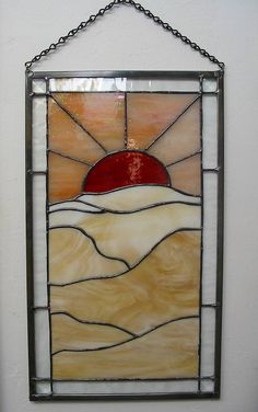 a stained glass window hanging on the wall