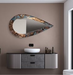 a bathroom with a sink and mirror on the wall next to a cabinet in front of it