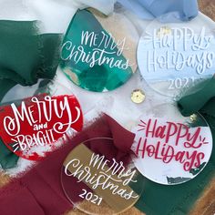 christmas ornament cutouts are sitting on top of some fabric and other holiday decorations