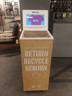 a laptop computer sitting on top of a wooden box