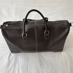 Designer: Lambertson Truex Style: Duffle Bag Color: Brown Material: Leather Retail: $795 Comes With Dust Bag Length: 19" Height: 12" Width: 10" Condition: Very Good, Few Small Scratches No Detachable Shoulder Strap Brown Rectangular Duffle Bag, Rectangular Brown Duffle Bag With Leather Trim, Brown Leather Duffle Bag For On-the-go, Brown Duffle Bag With Adjustable Strap For On-the-go, Brown Leather-lined Rectangular Duffle Bag, Leather Duffle Bag, Leather Duffle, Duffel Bags, Duffel Bag