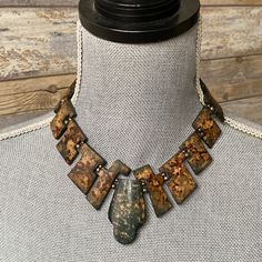 "Vintage Boho Horn Geometric Bib Necklace Rusty Khaki Green Brown  Beautiful vintage Rusty Khaki green dyed horn bib necklace. Consisted of geometric elements and silver toned separators, hook and loop closing. Great vintage condition.  Measurements  Length: over 38cm/15\" Bib width: 6.5cm/2.5\"" Artisan Metal Necklaces With Patina, Artisan Metal Necklace With Patina, Bohemian Metal Necklaces With Patina, Artisan Green Metal Necklace, Natural Pearl Necklace, Geometric Elements, Horn Necklace, Contemporary Pendant, Bib Necklaces