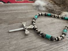 Simple yet powerful, a true labor of love! ~ Limited Quantity ~~ This awesome cross was made by an artist from vintage nails, sand-cast in white bronze sterling silver, hand stamped, and wire wrapped! ~Graced with a Lovely Strand of Navajo Handmade Pearls with Pumpkin Beads and turquoise Handmade by Navajo Artists exclusively for Navajo Pearls Ranch!~Choose Your Length ~Each bead is heavily plated in .925 sterling silver, hand polished & antiqued, creating a perfect handmade Navajo Pearl.You won Pumpkin Beads, Pumpkin Bead, Vintage Nails, Navajo Pearls, Handmade Pendant Necklace, Navajo Style, Pendant Necklace Simple, Turquoise Cross, Necklace Simple