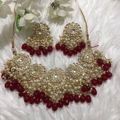 Imitation kundan style in gold with red beads  Necklace and earrings only