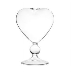 a heart shaped glass on a white background