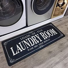 the laundry room door mat is next to washer and dryer