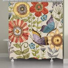 a shower curtain with flowers and butterflies on it